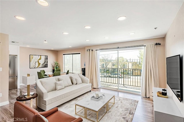 10290 Tujunga Canyon Blvd Unit 102, Tujunga, CA 91402 - living area featuring healthy amount of natural light, light wood-type flooring, recessed lighting, and baseboards