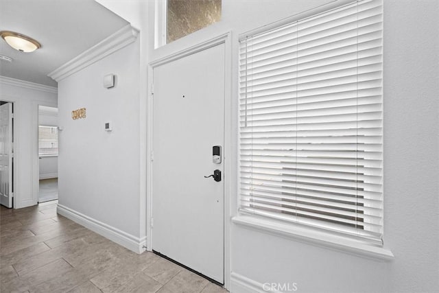 3936 W 5th St Unit 44, Santa Ana, CA 92703 - foyer entrance featuring ornamental molding, baseboards, and healthy amount of natural light