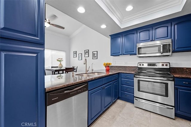 3936 W 5th St Unit 44, Santa Ana, CA 92703 - kitchen featuring stainless steel appliances, ornamental molding, blue cabinets, a sink, and ceiling fan