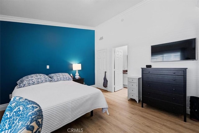 3936 W 5th St Unit 44, Santa Ana, CA 92703 - bedroom featuring ornamental molding, wood finished floors, and baseboards