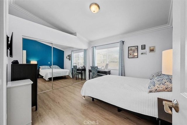 3936 W 5th St Unit 44, Santa Ana, CA 92703 - bedroom featuring crown molding, lofted ceiling, and wood finished floors