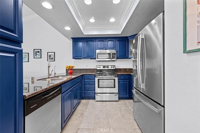 3936 W 5th St Unit 44, Santa Ana, CA 92703 - kitchen with appliances with stainless steel finishes, blue cabinetry, ornamental molding, a sink, and a tray ceiling