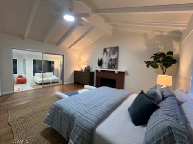 bedroom with wood finished floors, baseboards, and a ceiling fan