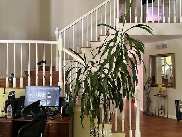 23838 Spring Branch Ct, Murrieta, CA 92562 - stairway featuring wood finished floors
