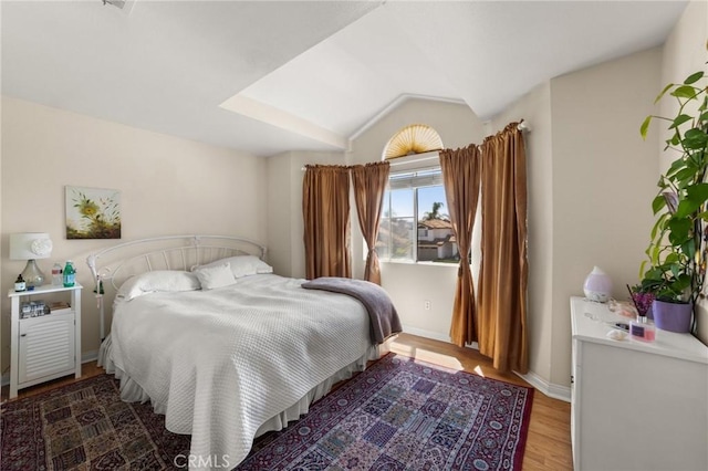 23838 Spring Branch Ct, Murrieta, CA 92562 - bedroom with light wood finished floors, vaulted ceiling, and baseboards