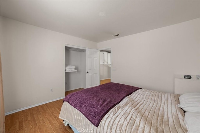23838 Spring Branch Ct, Murrieta, CA 92562 - bedroom with wood finished floors, a closet, and baseboards