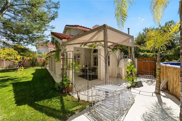 23838 Spring Branch Ct, Murrieta, CA 92562 - rear view of house featuring stucco siding, a tiled roof, and a patio area