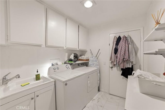 23838 Spring Branch Ct, Murrieta, CA 92562 - laundry area featuring washer and dryer, cabinet space, and light marble finish floors