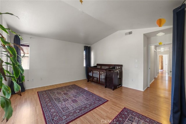 23838 Spring Branch Ct, Murrieta, CA 92562 - bedroom featuring lofted ceiling, wood finished floors, and baseboards