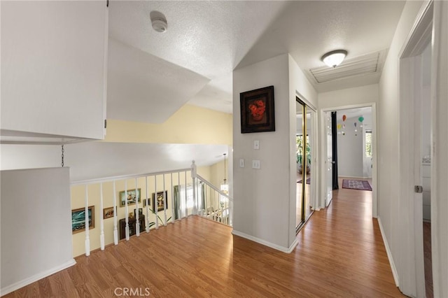 23838 Spring Branch Ct, Murrieta, CA 92562 - corridor featuring wood finished floors, an upstairs landing, and baseboards