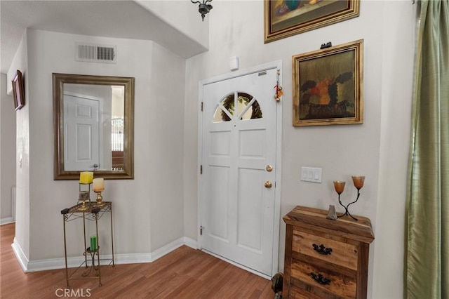 23838 Spring Branch Ct, Murrieta, CA 92562 - foyer entrance featuring wood finished floors and baseboards