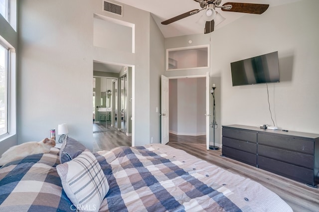 10025 Thornbird Ct, Moreno Valley, CA 92557 - bedroom with wood finished floors, ceiling fan, and a towering ceiling