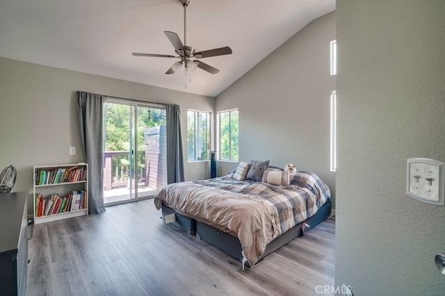 10025 Thornbird Ct, Moreno Valley, CA 92557 - bedroom featuring access to exterior, lofted ceiling, wood finished floors, a ceiling fan, and a textured wall