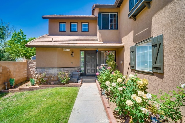 10025 Thornbird Ct, Moreno Valley, CA 92557 - property entrance featuring stucco siding
