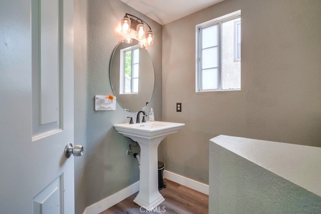 10025 Thornbird Ct, Moreno Valley, CA 92557 - bathroom with wood finished floors and baseboards