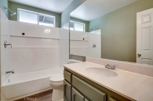 10025 Thornbird Ct, Moreno Valley, CA 92557 - full bath featuring toilet, shower / washtub combination, wood finished floors, and vanity