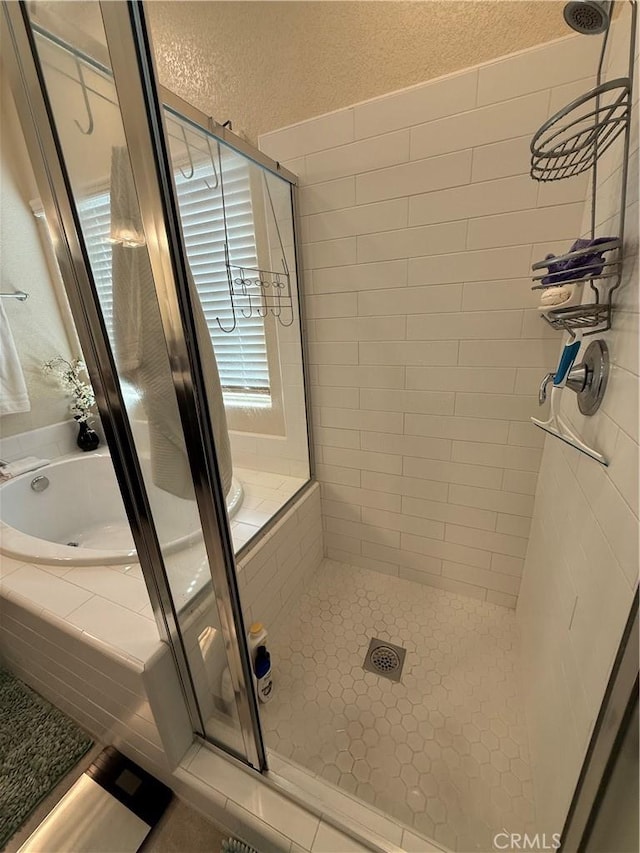 3751 De Soto Way, Merced, CA 95340 - bathroom featuring a shower stall, a bath, and plenty of natural light