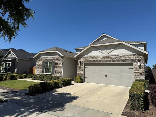 3751 De Soto Way, Merced, CA 95340 - view of front of home with stone siding, a garage, driveway, stucco siding, and a front yard