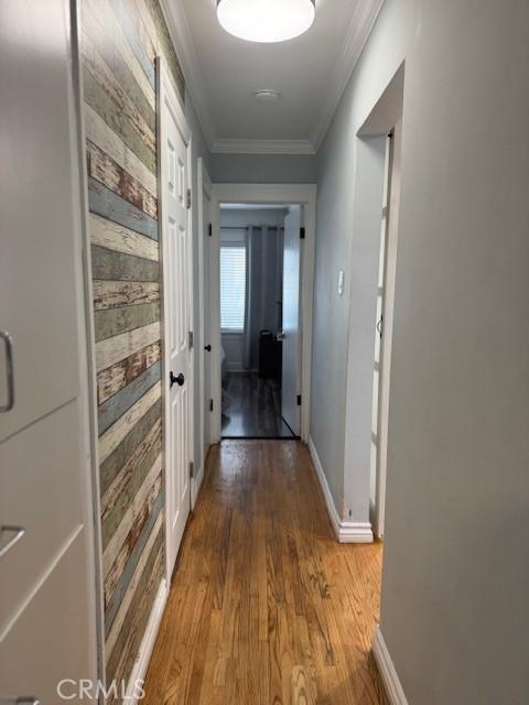 807 N Pearl Ave, Compton, CA 90221 - hall featuring light wood-style flooring, ornamental molding, and baseboards