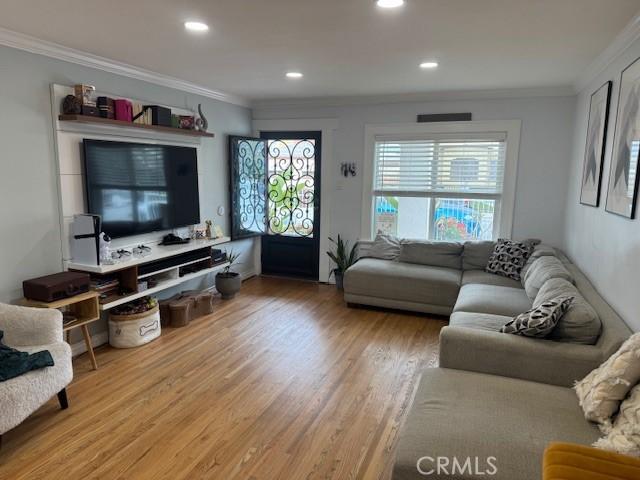 807 N Pearl Ave, Compton, CA 90221 - living room with crown molding, wood finished floors, and recessed lighting