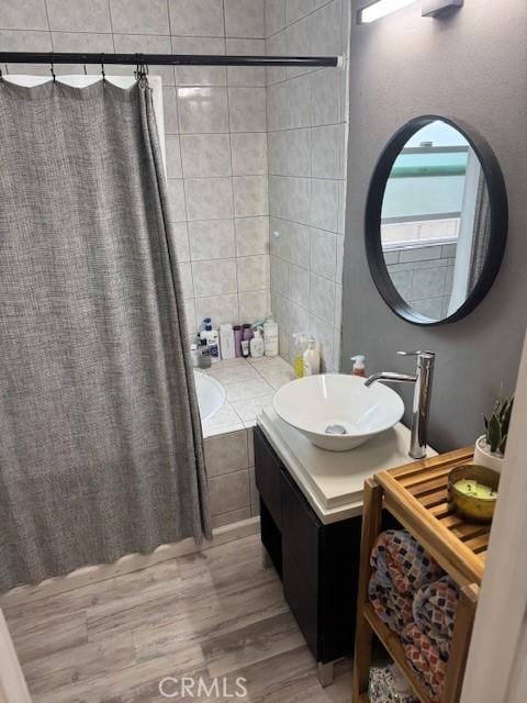 807 N Pearl Ave, Compton, CA 90221 - bathroom with wood finished floors and vanity