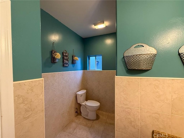 8921 Deer Trl, Frazier Park, CA 93225 - bathroom with tile walls, a wainscoted wall, tile patterned flooring, and toilet