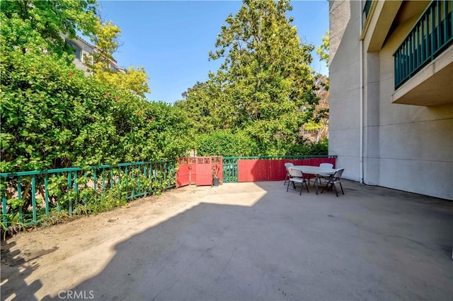 4200 Via Arbolada Unit 123, Los Angeles, CA 90042 - view of patio with outdoor dining area and fence