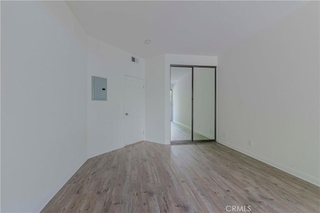 4200 Via Arbolada Unit 123, Los Angeles, CA 90042 - spare room with electric panel, wood finished floors, and baseboards