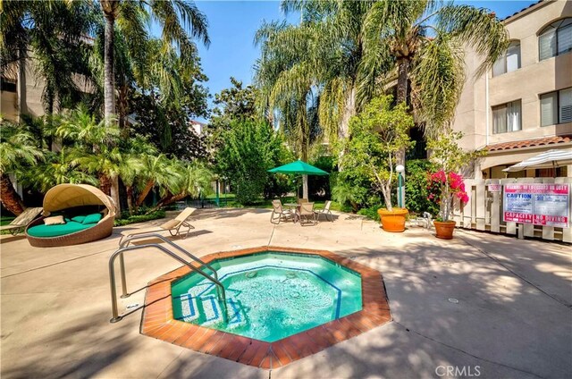 4200 Via Arbolada Unit 123, Los Angeles, CA 90042 - view of pool featuring a community hot tub and a patio