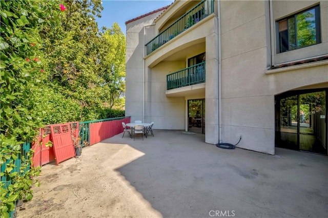 4200 Via Arbolada Unit 123, Los Angeles, CA 90042 - view of patio featuring outdoor dining space and fence