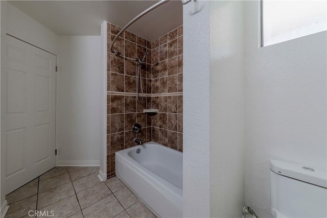 4200 Via Arbolada Unit 123, Los Angeles, CA 90042 - bathroom with tile patterned flooring, bathing tub / shower combination, toilet, and baseboards
