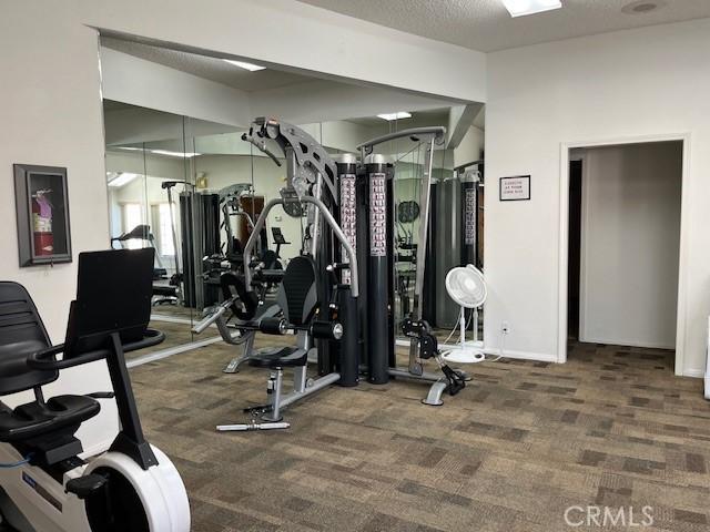 3060 Summer Set Cir, Banning, CA 92220 - gym featuring carpet floors and baseboards