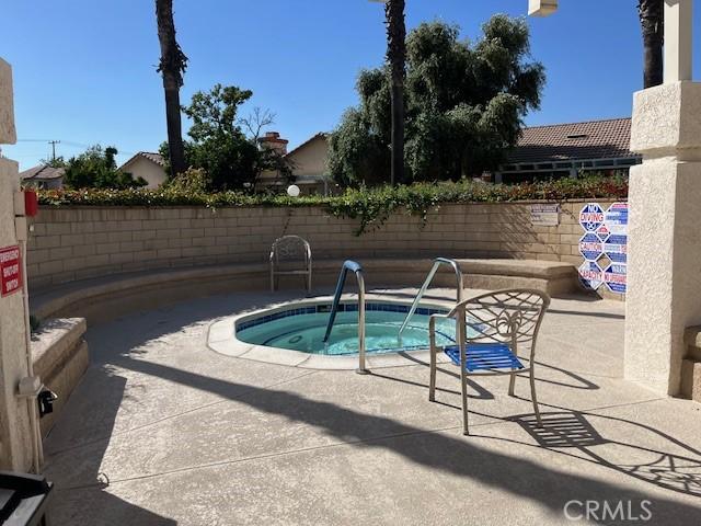 3060 Summer Set Cir, Banning, CA 92220 - view of swimming pool with a hot tub and a patio