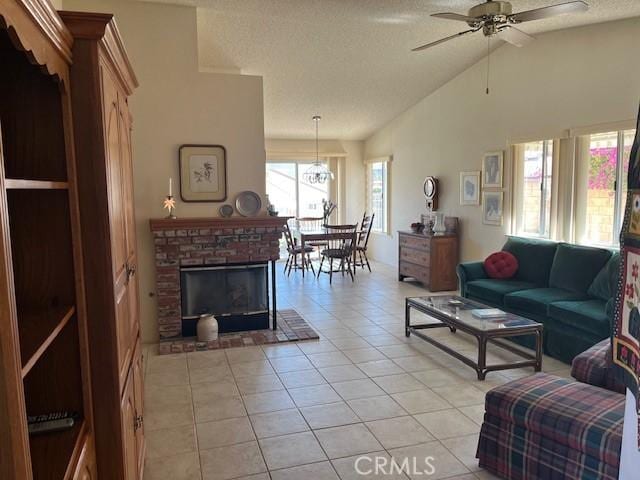 3060 Summer Set Cir, Banning, CA 92220 - living area with light tile patterned floors, a textured ceiling, lofted ceiling, and a ceiling fan