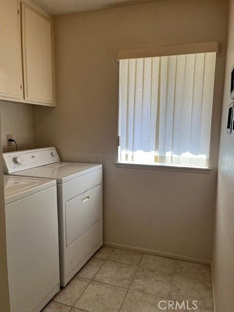 3060 Summer Set Cir, Banning, CA 92220 - washroom with independent washer and dryer, cabinet space, baseboards, and light tile patterned floors