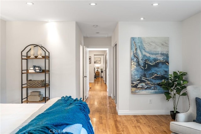 bedroom featuring light wood-style floors, recessed lighting, and baseboards