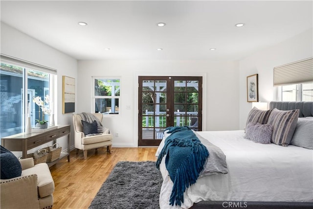 bedroom featuring french doors, access to outside, light wood-style floors, recessed lighting, and baseboards
