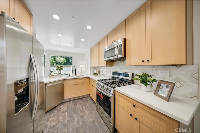 13385 Savanna, Tustin, CA 92782 - kitchen featuring appliances with stainless steel finishes, light brown cabinets, a sink, wood finished floors, and tasteful backsplash