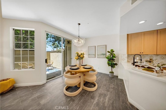 13385 Savanna, Tustin, CA 92782 - dining area featuring baseboards, a chandelier, dark wood-style floors, lofted ceiling, and recessed lighting