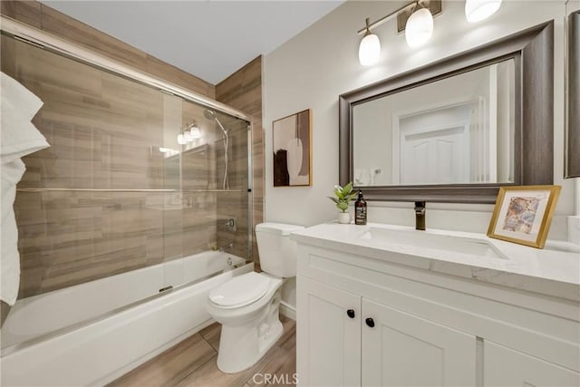 13385 Savanna, Tustin, CA 92782 - full bath featuring toilet, vanity, bath / shower combo with glass door, and wood finished floors