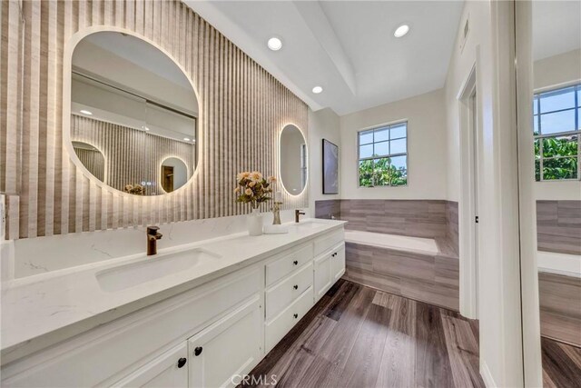 13385 Savanna, Tustin, CA 92782 - full bath with tile walls, double vanity, a bath, a wainscoted wall, and recessed lighting