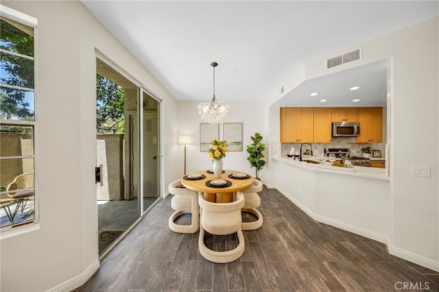 13385 Savanna, Tustin, CA 92782 - dining room with dark wood-style flooring, a chandelier, baseboards, and recessed lighting