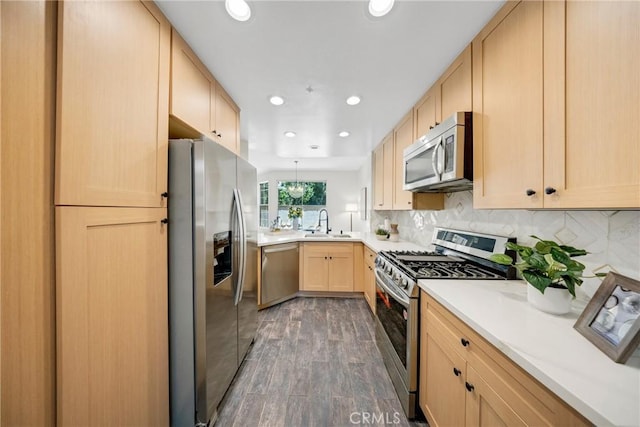 13385 Savanna, Tustin, CA 92782 - kitchen featuring stainless steel appliances, light brown cabinetry, a sink, dark wood-type flooring, and light countertops