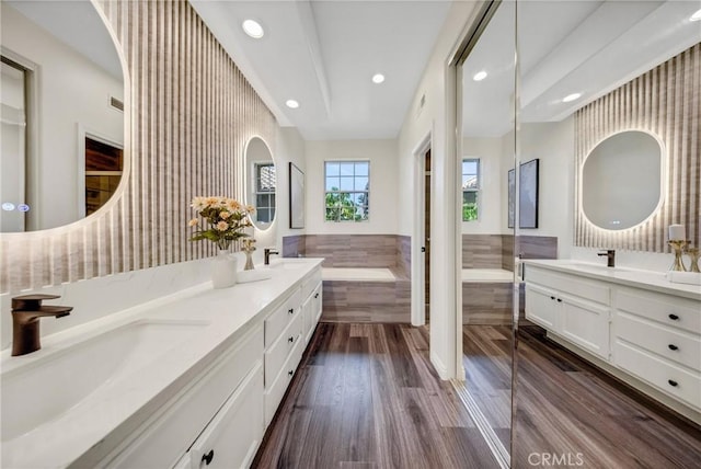 13385 Savanna, Tustin, CA 92782 - full bath featuring recessed lighting, double vanity, a bath, wood finished floors, and an enclosed shower
