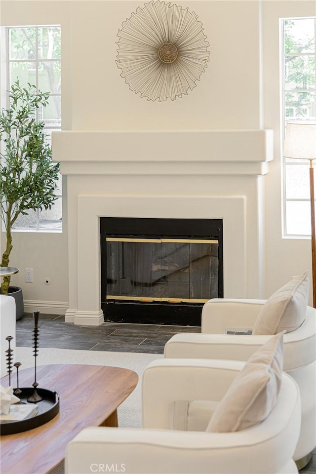 13385 Savanna, Tustin, CA 92782 - detailed view of a glass covered fireplace, wood finished floors, and baseboards