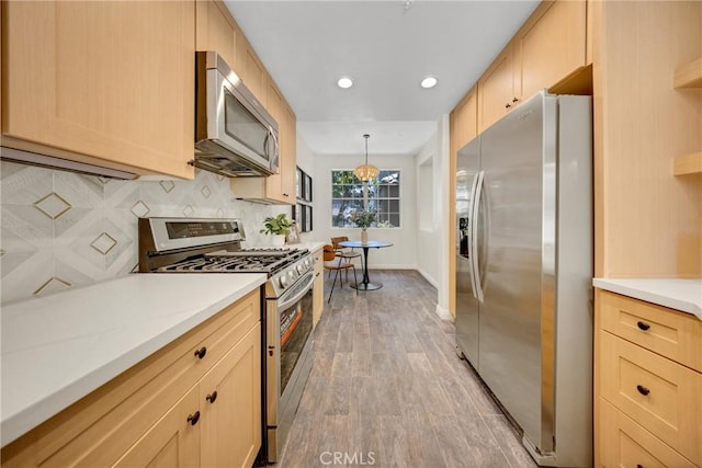 13385 Savanna, Tustin, CA 92782 - kitchen featuring stainless steel appliances, light brown cabinets, light wood-style flooring, light countertops, and recessed lighting