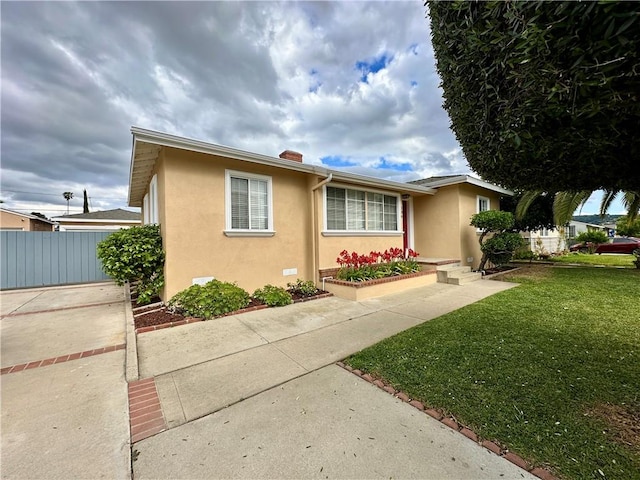 136 S Fircroft St, West Covina, CA 91791 - view of front of home featuring stucco siding and a chimney