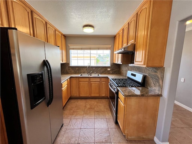 136 S Fircroft St, West Covina, CA 91791 - kitchen with appliances with stainless steel finishes, a sink, under cabinet range hood, decorative backsplash, and a textured ceiling