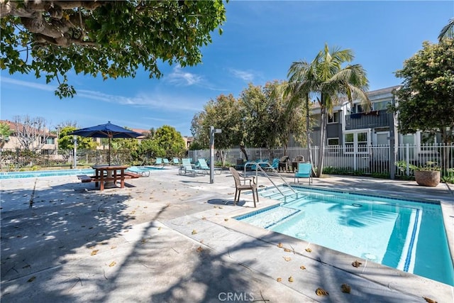 17072 Pacific Coast Unit 202, Huntington Beach, CA 92649 - community pool with a patio and fence