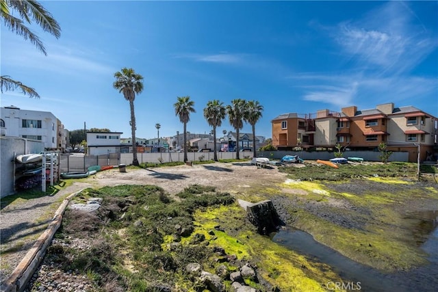 17072 Pacific Coast Unit 202, Huntington Beach, CA 92649 - view of yard with a residential view and fence